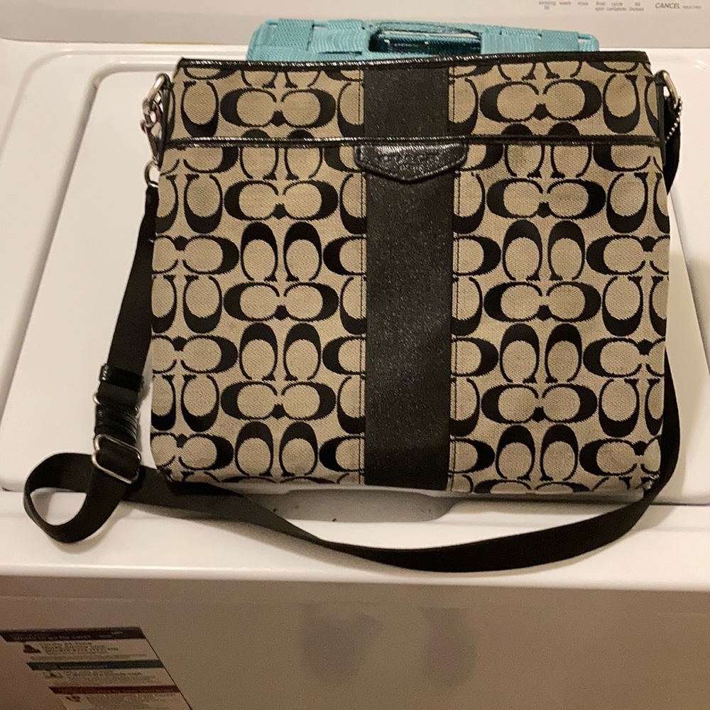 Black and grey coach purse.